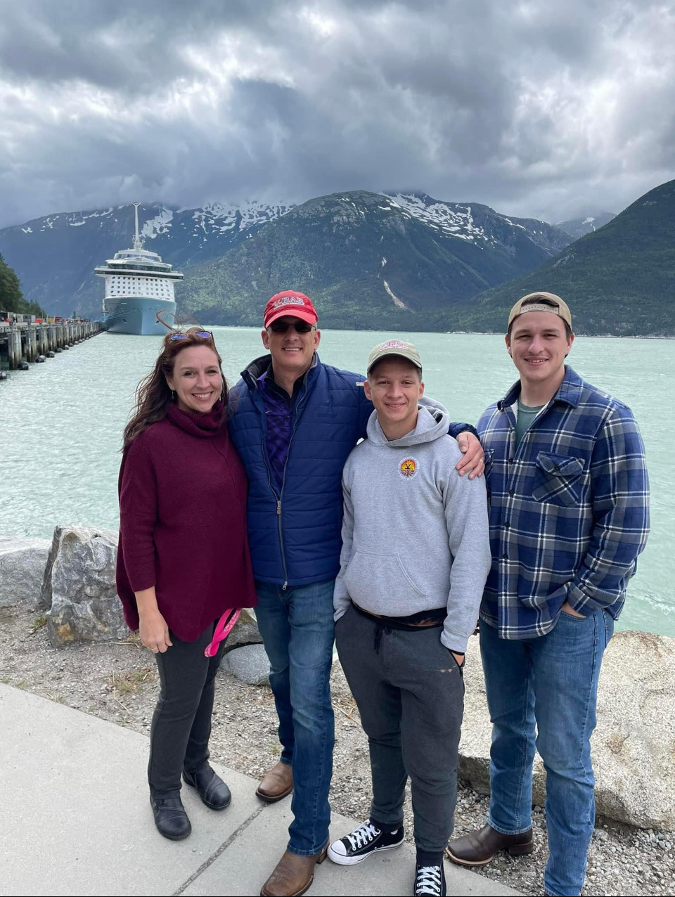 Chuck, Lisette, and family in front of a lake
